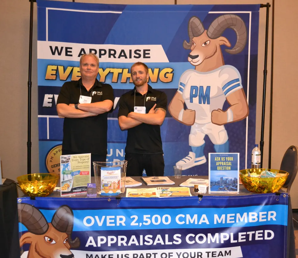 Paul Marinkovich and a PM Appraisal team member at the PM Appraisal booth at a California Mortgage Association event